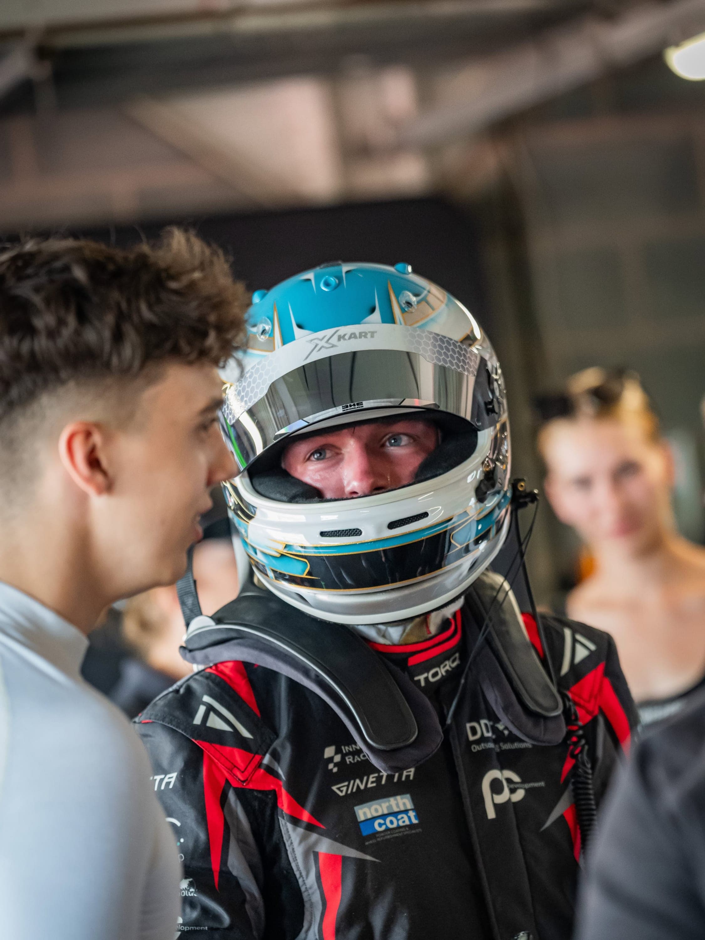 James Wareing debriefing with the team in his custom Racecraft