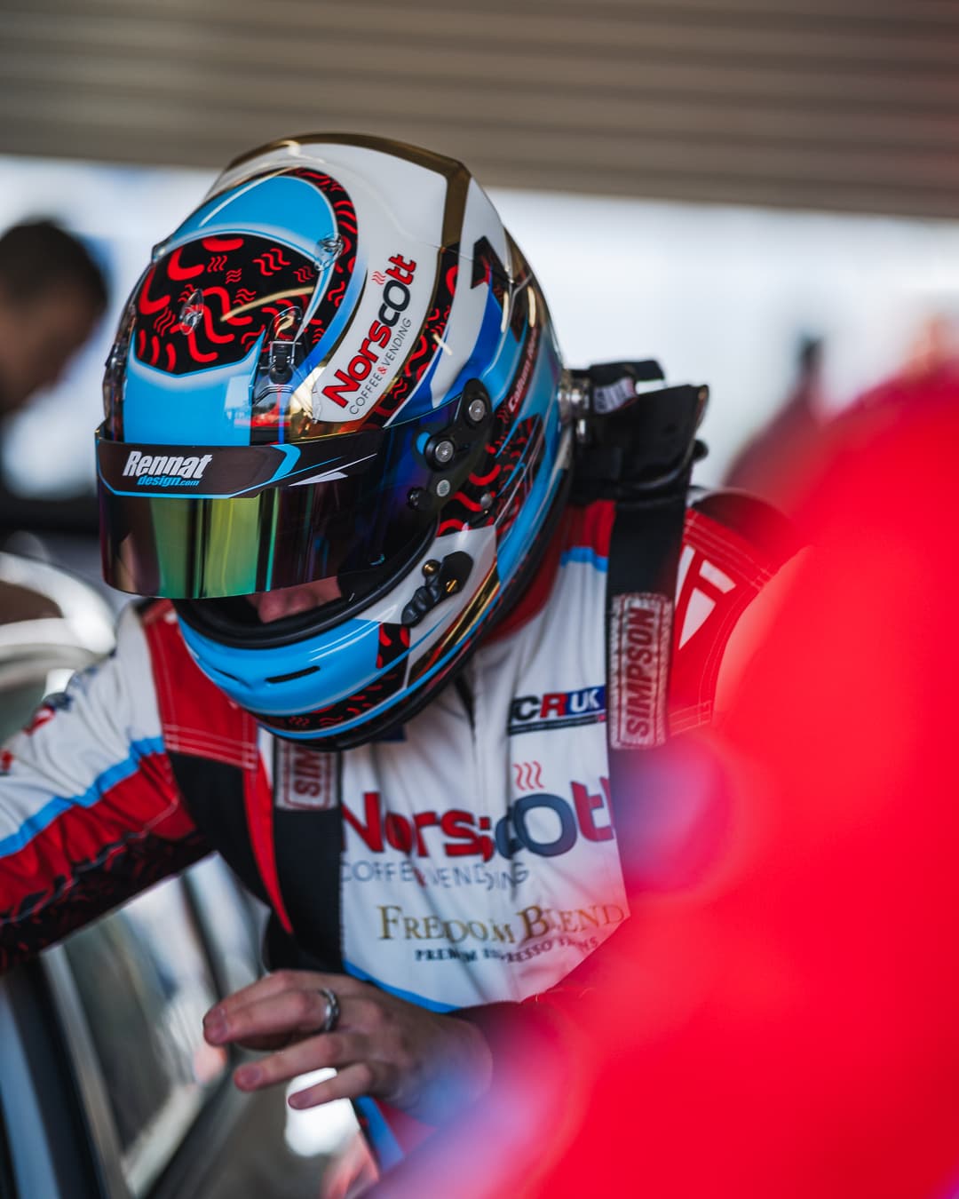Callum Newsham about to jump in his Hyundai Elantra TCR UK car wearing his bespoke Racecraft suit